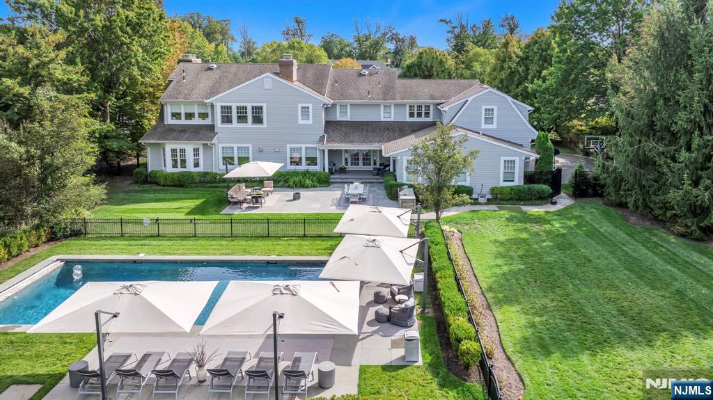 187 Buckingham Road Tenafly, NJ 07670 - Photo 4 of 50 a aerial view of a house with a yard table and chairs