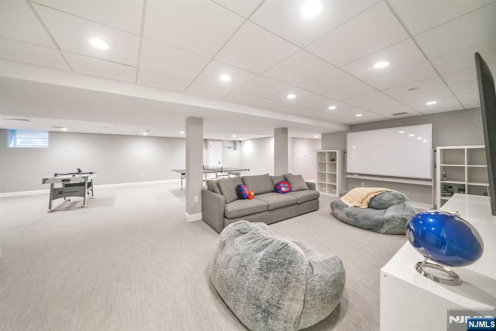 187 Buckingham Road Tenafly, NJ 07670 - Photo 43 of 50 a living room with furniture and a table