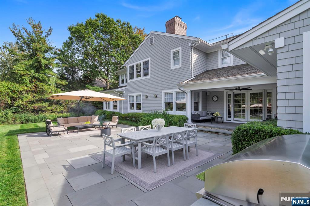 187 Buckingham Road Tenafly, NJ 07670 - Photo 7 of 50 a view of a house with backyard and sitting area