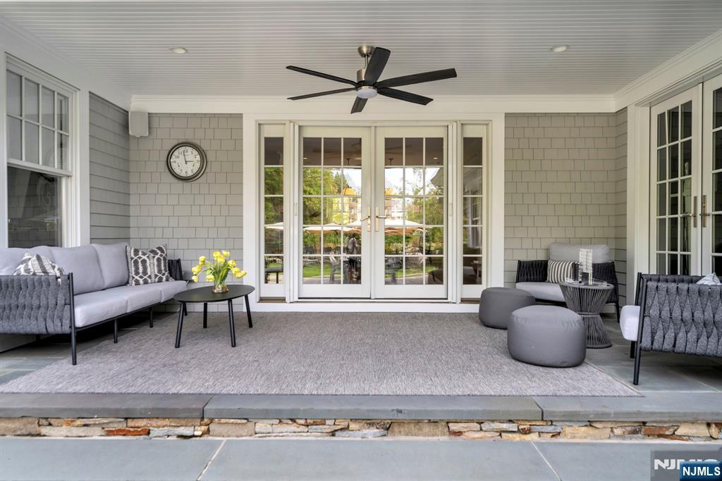 187 Buckingham Road Tenafly, NJ 07670 - Photo 8 of 50 a living room with furniture wooden floor and a large window
