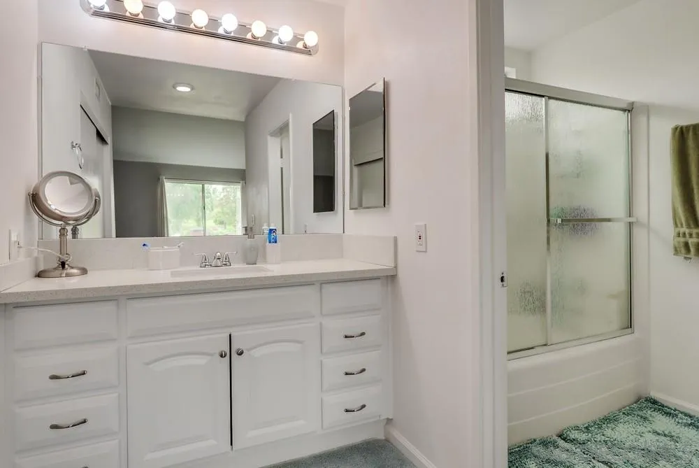 23667 Country Villa Road Ramona, CA 92065 - Photo 14 of 25 a bathroom with a shower sink and mirror