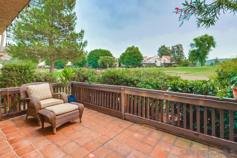 23667 Country Villa Road Ramona, CA 92065 - Photo 18 of 25 a balcony with wooden floor and outdoor seating