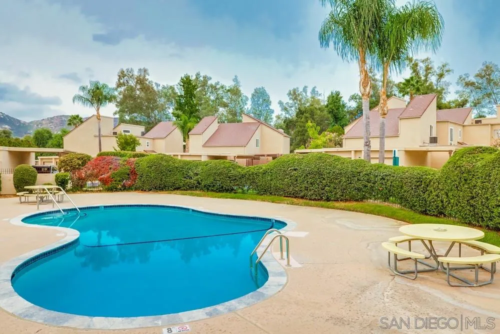 23667 Country Villa Road Ramona, CA 92065 - Photo 24 of 25 a view of a swimming pool with a yard