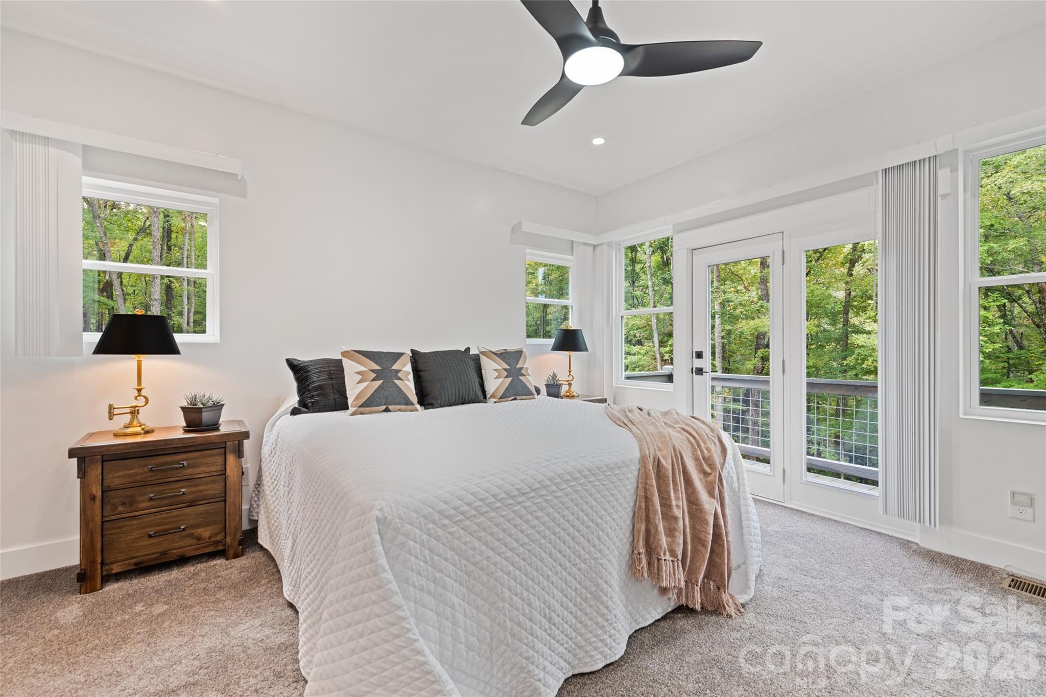 1185 Wallalieu Road Otto, NC 28763 - Photo 21 of 43 a bedroom with bed and a window