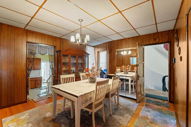 a view of a patio with table and chairs and potted plants