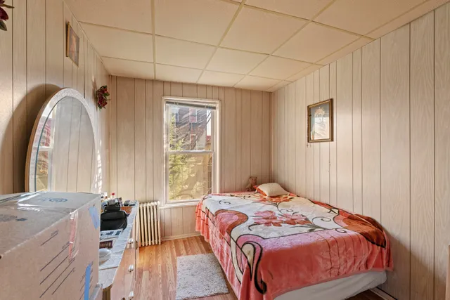 a kitchen with stainless steel appliances kitchen island granite countertop a table chairs and a refrigerator