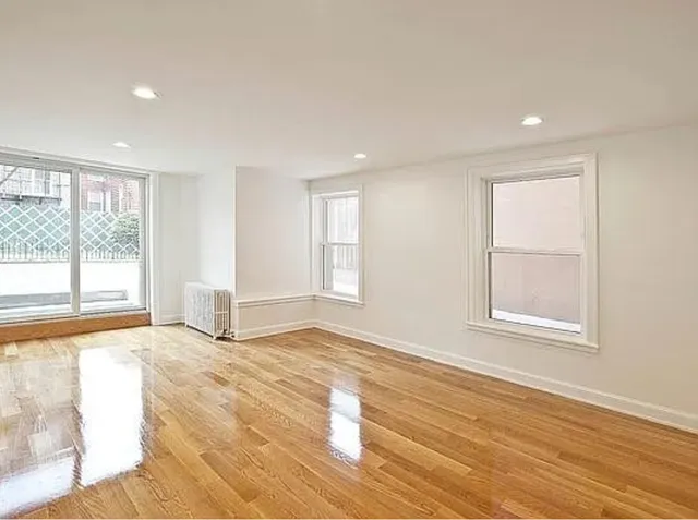 a kitchen with stainless steel appliances a sink stove and refrigerator
