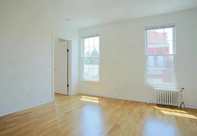 a view of kitchen and wooden floor