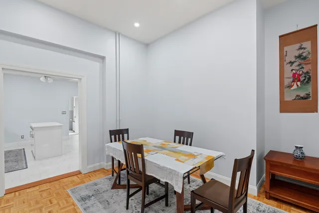 a living room with furniture rug and a table