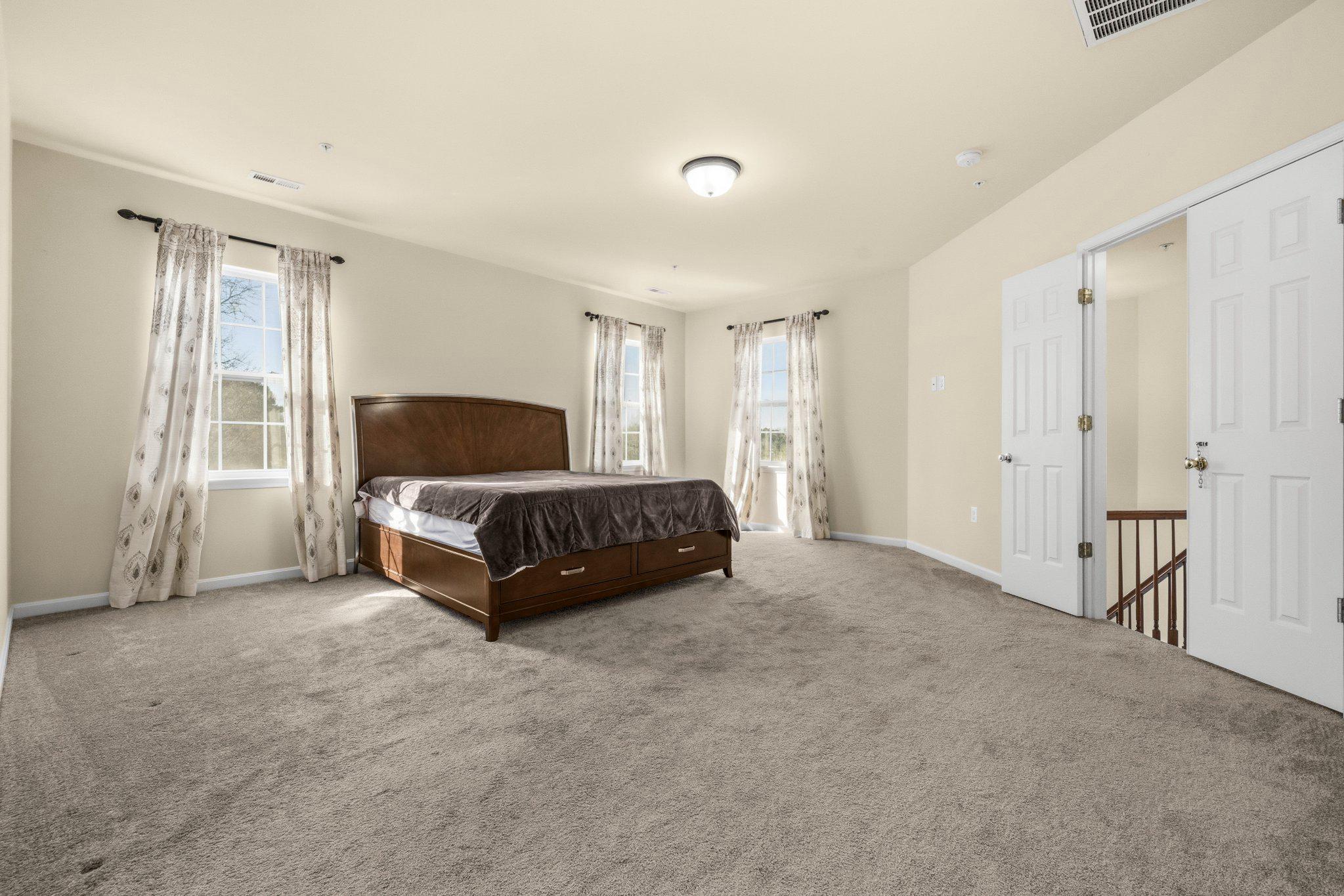 41377 Doctors Crossing Road Leonardtown, MD 20650 - Photo 27 of 48 Spacious, sunlit primary bedroom retreat.