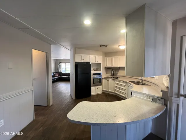 a kitchen with refrigerator and stove