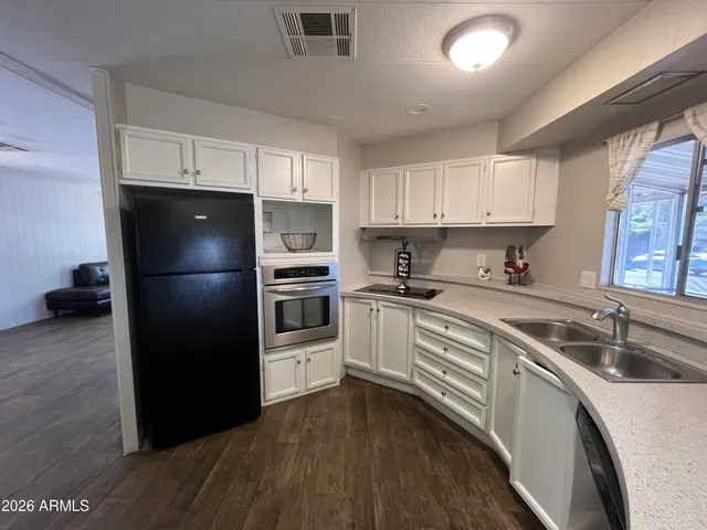 a kitchen with a refrigerator a sink and dishwasher