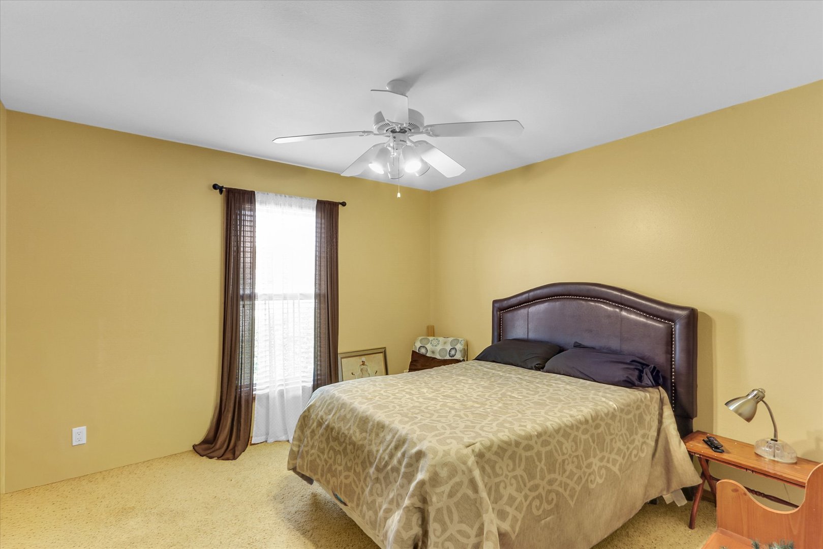 3110 Ridge Park Road Urbana, IL 61802 - Photo 15 of 26 a bedroom with a bed and a chandelier