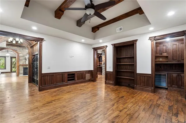 a spacious bathroom with a granite countertop tub sink and mirror