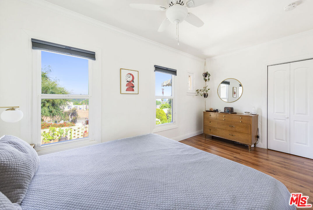 3922 Edison Walk Los Angeles, CA 90032 - Photo 13 of 26 a bedroom with furniture and a window