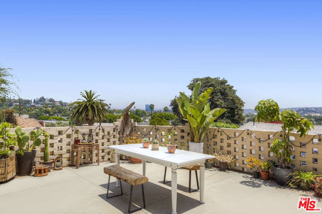 3922 Edison Walk Los Angeles, CA 90032 - Photo 22 of 26 a view of a chairs and table in patio