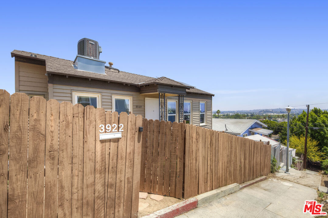 3922 Edison Walk Los Angeles, CA 90032 - Photo 23 of 26 a front view of a house with a garden