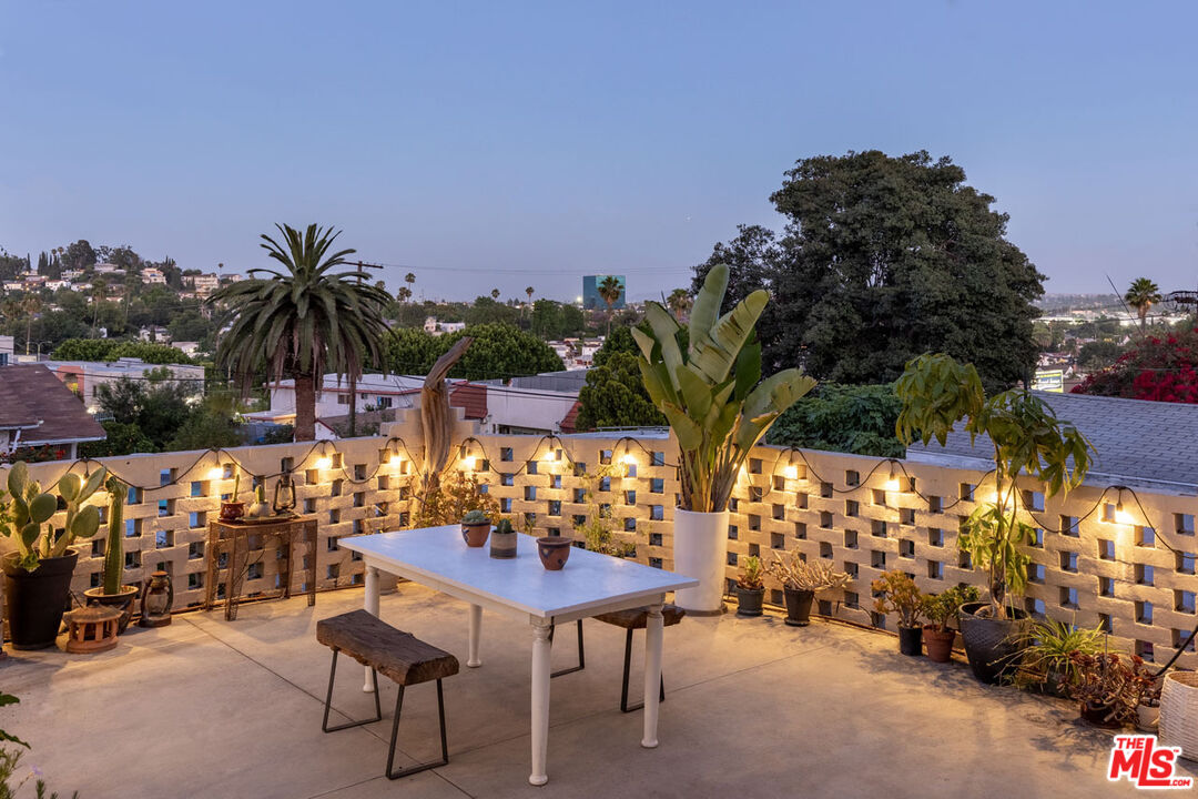 3922 Edison Walk Los Angeles, CA 90032 - Photo 25 of 26 a couple of table and chairs in a patio
