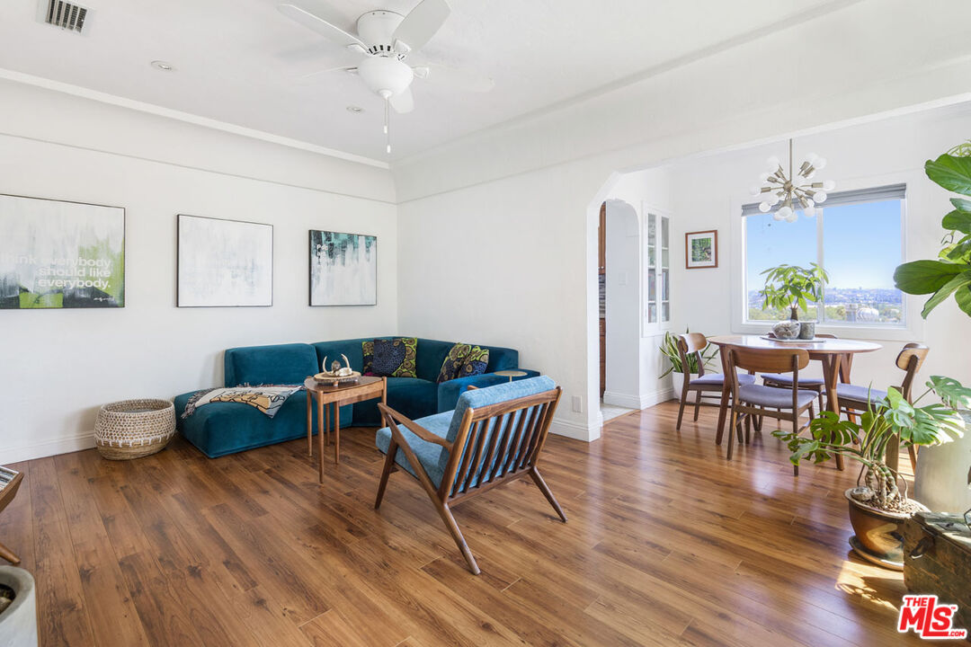 3922 Edison Walk Los Angeles, CA 90032 - Photo 3 of 26 a living room with furniture and a wooden floor