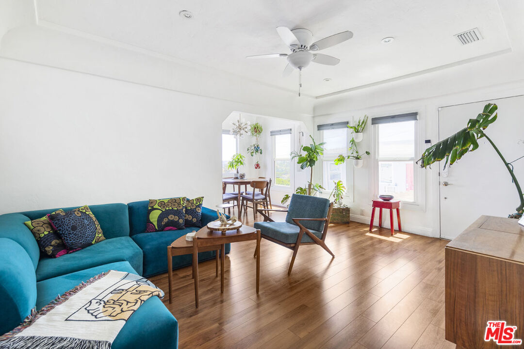 3922 Edison Walk Los Angeles, CA 90032 - Photo 4 of 26 a living room with furniture and a wooden floor