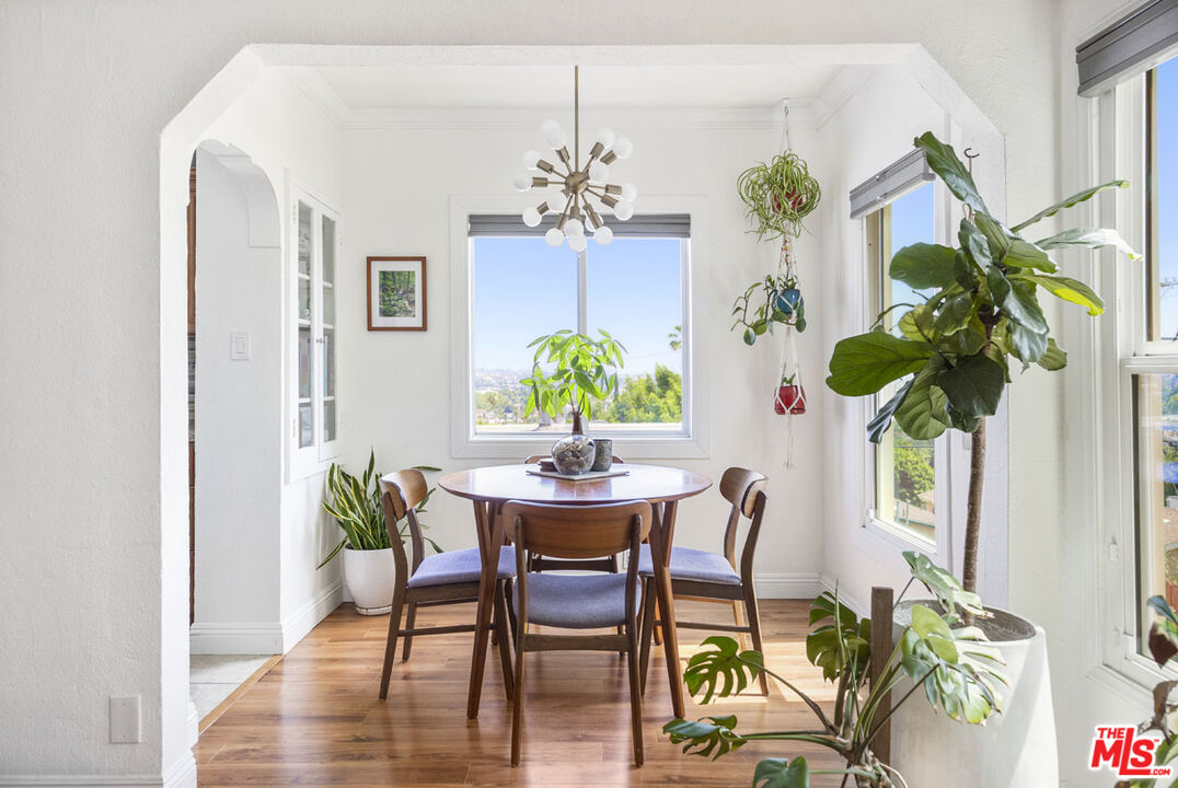 3922 Edison Walk Los Angeles, CA 90032 - Photo 5 of 26 a view of a dining room with furniture and a potted plant