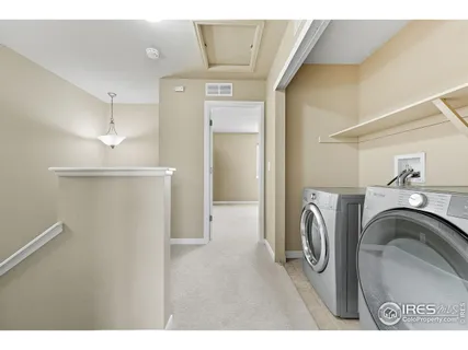 a view of a kitchen with a washer and dryer