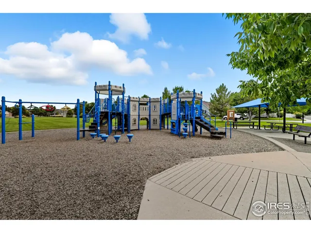a view of a park with swings and slides
