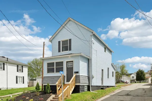a view of a house with a yard