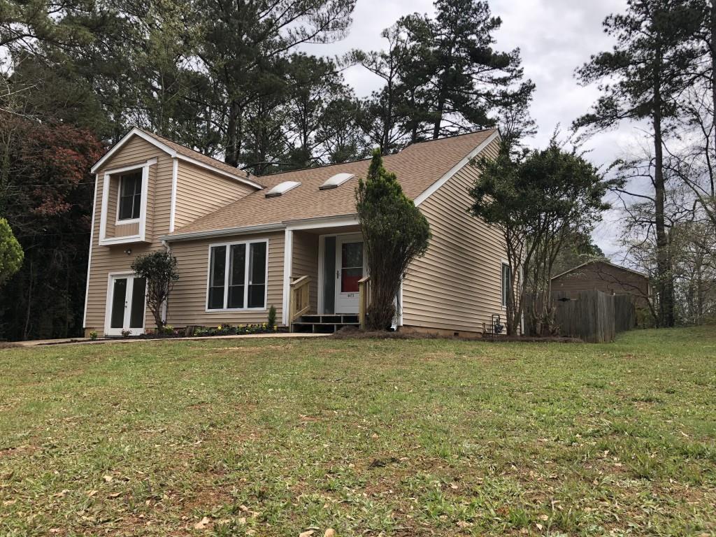 4473 Shady Leaf Lane Decatur, GA 30034 - Photo 1 of 1 a white house that has a tree in front of it