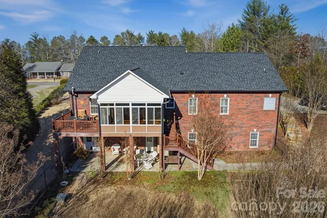 a aerial view of a house with a yard from a balcony