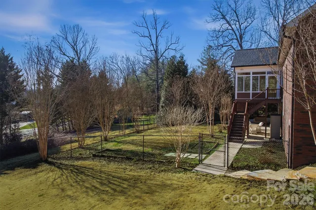 a view of a backyard with trees