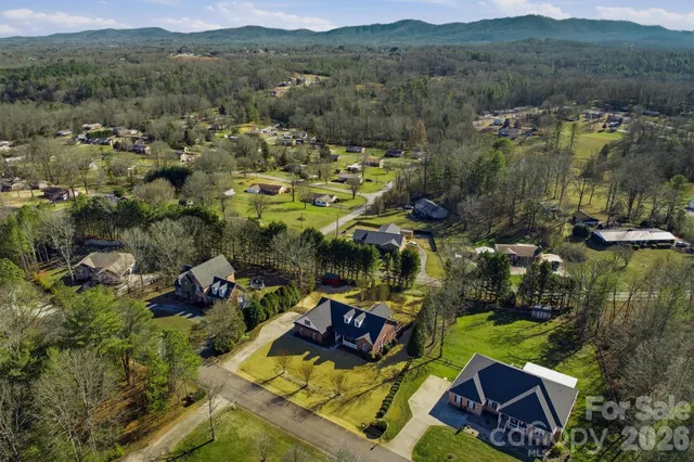an aerial view of a house with a garden