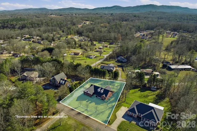 an aerial view of a house with a garden