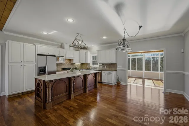 a view of kitchen with cabinets and wooden floor