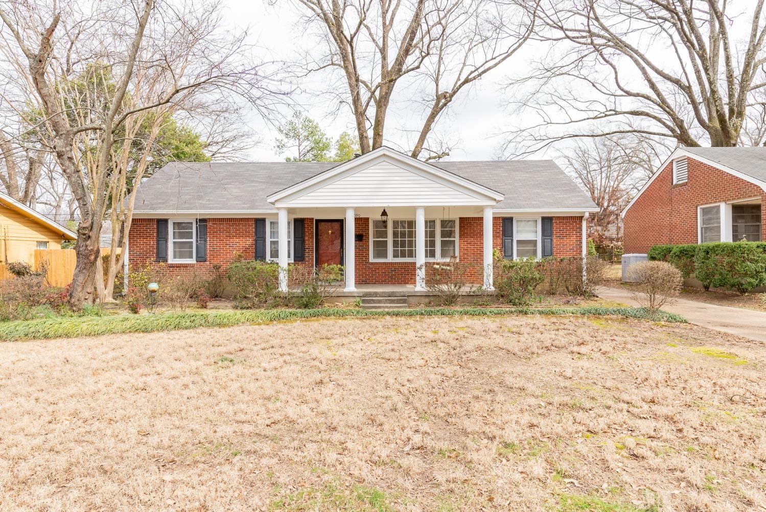 1090 Marcia Road Memphis, TN 38117 - Photo 1 of 25 a front view of a house with a yard