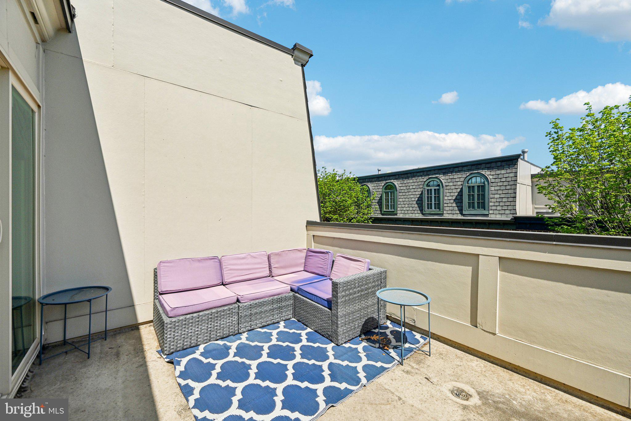 24 South Regester Street Baltimore, MD 21231 - Photo 32 of 44 a balcony with furniture and a potted plant