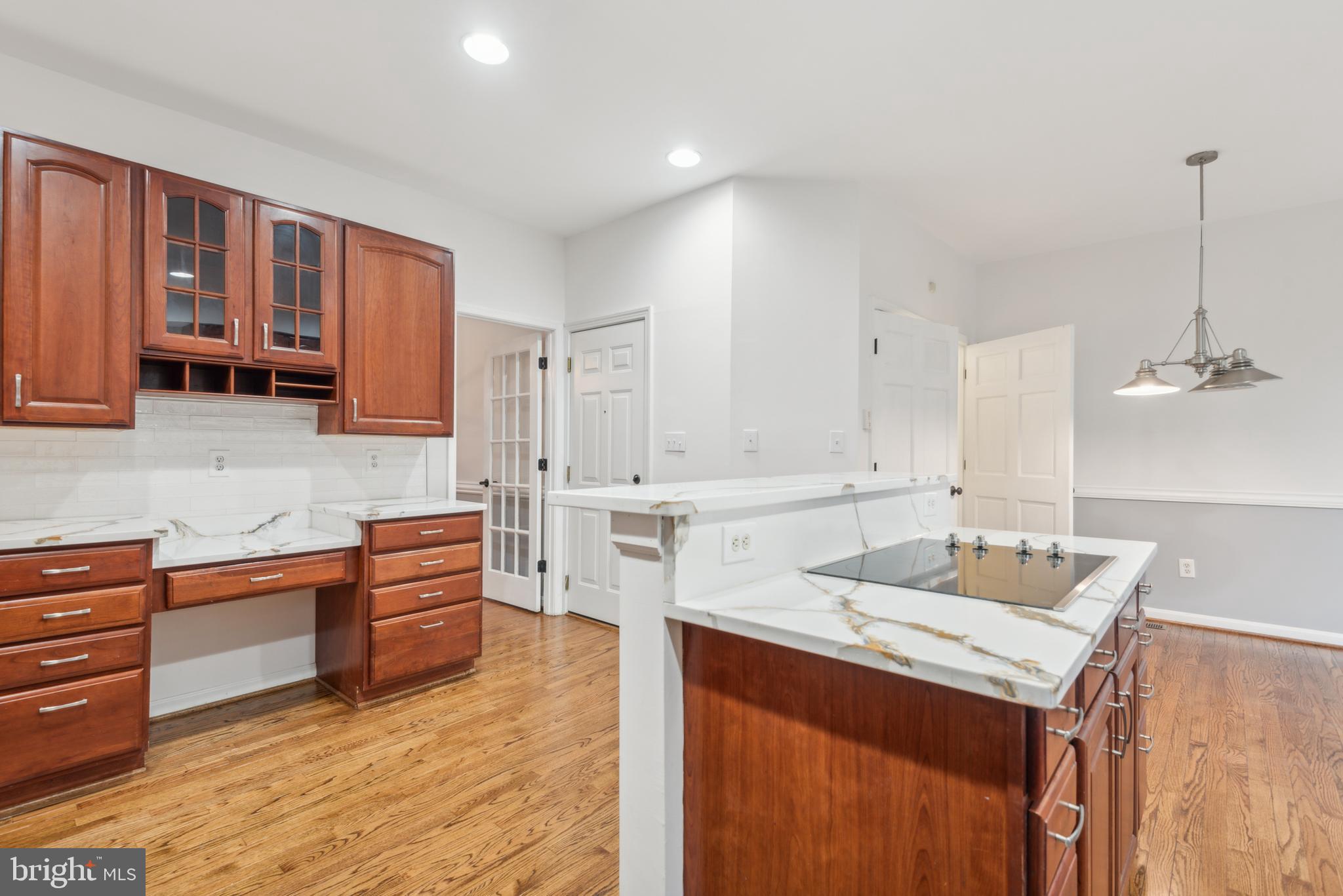 1825 Johnson Road Annapolis, MD 21409 - Photo 14 of 44 a kitchen with stainless steel appliances granite countertop a sink dishwasher stove and cabinets with wooden floor