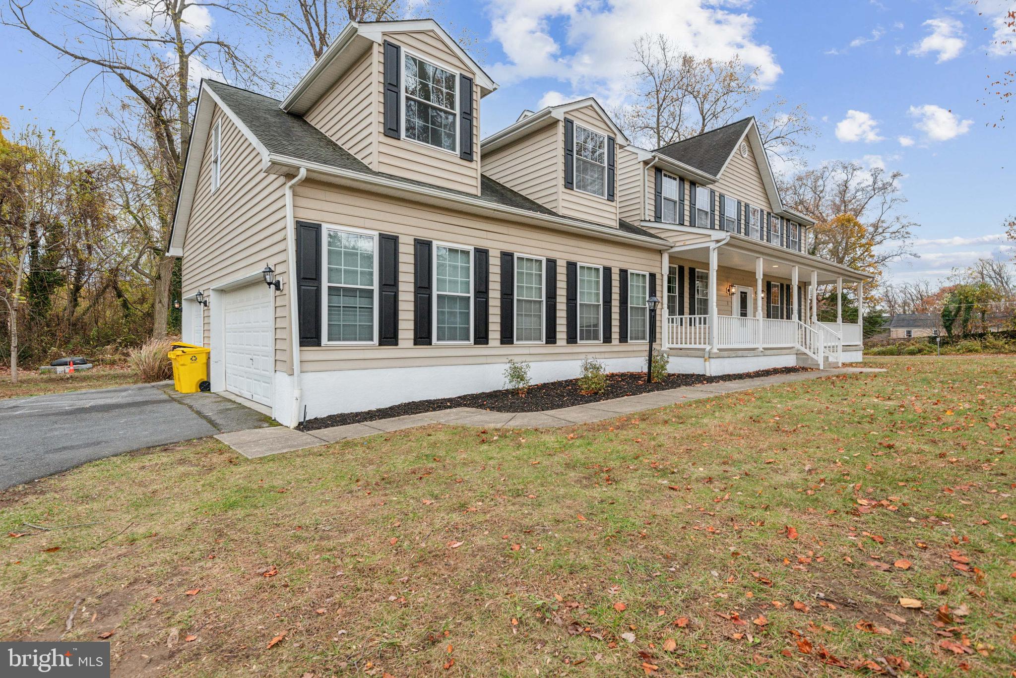 1825 Johnson Road Annapolis, MD 21409 - Photo 2 of 44 a front view of a house with a yard