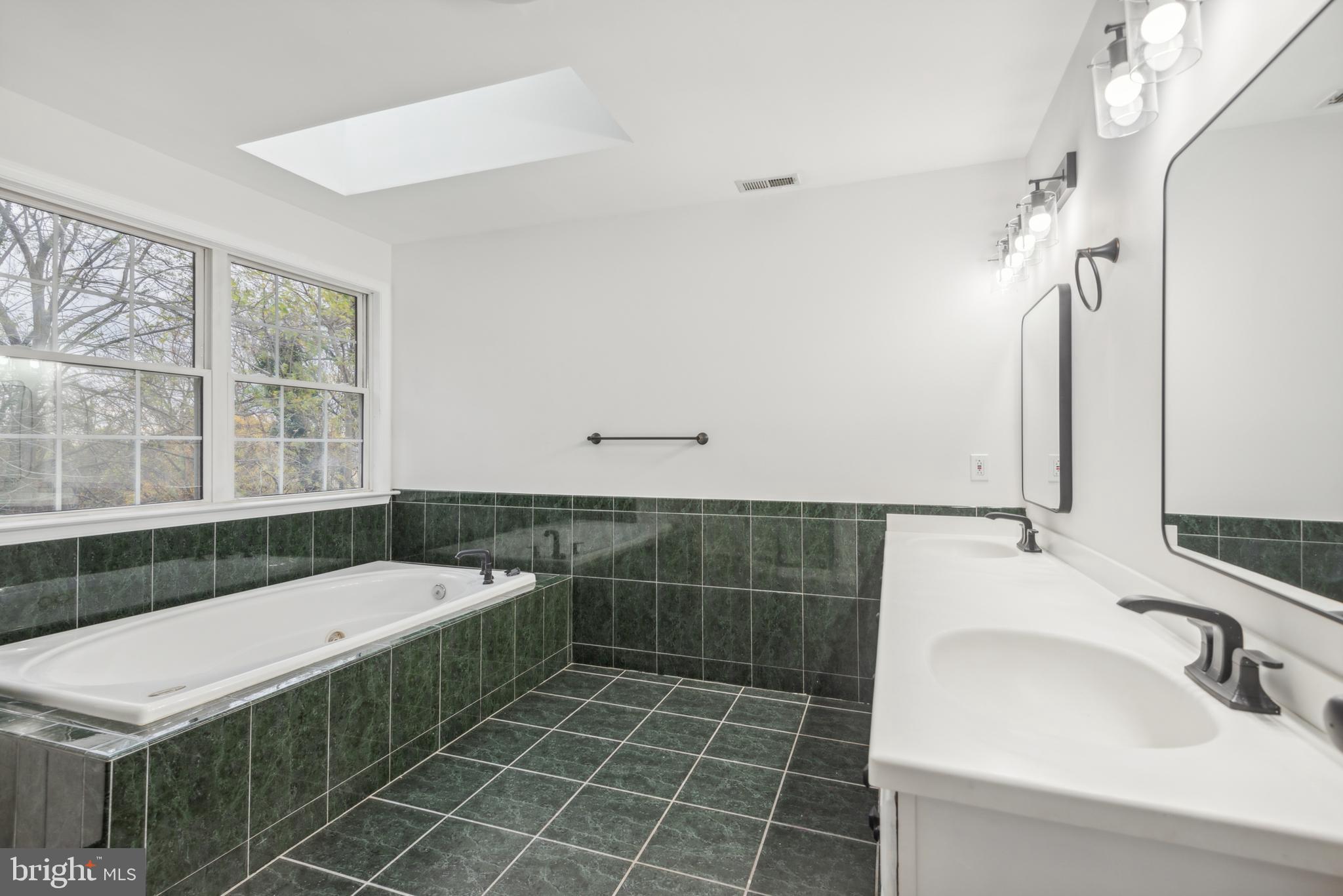 1825 Johnson Road Annapolis, MD 21409 - Photo 22 of 44 a bathroom with a sink and a bathtub