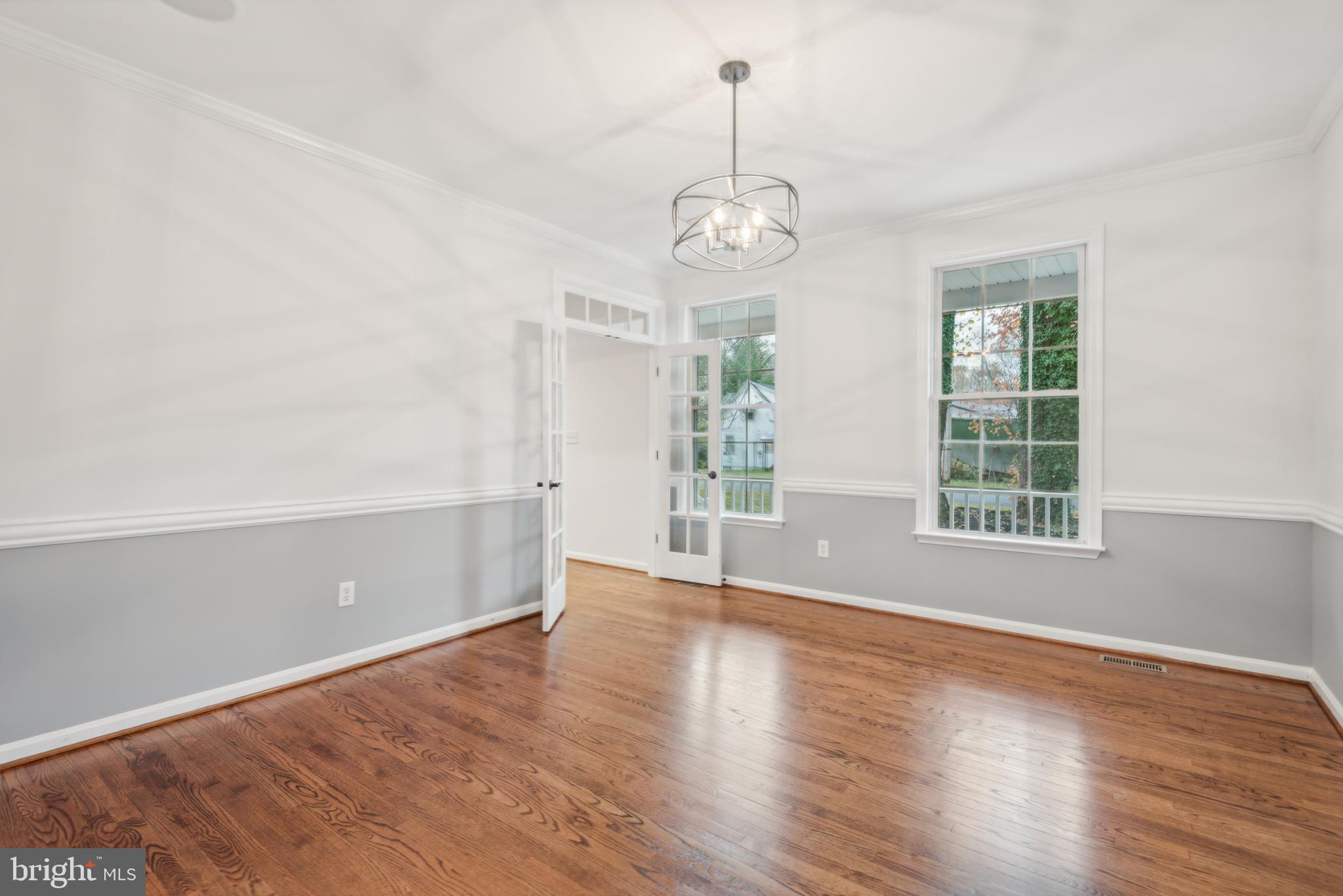 1825 Johnson Road Annapolis, MD 21409 - Photo 10 of 44 an empty room with wooden floor and windows