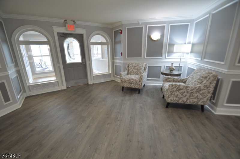 1 Jenny Lind Street, Unit 20 Netcong, NJ 07857 - Photo 4 of 25 a living room with furniture and a large mirror next to a window