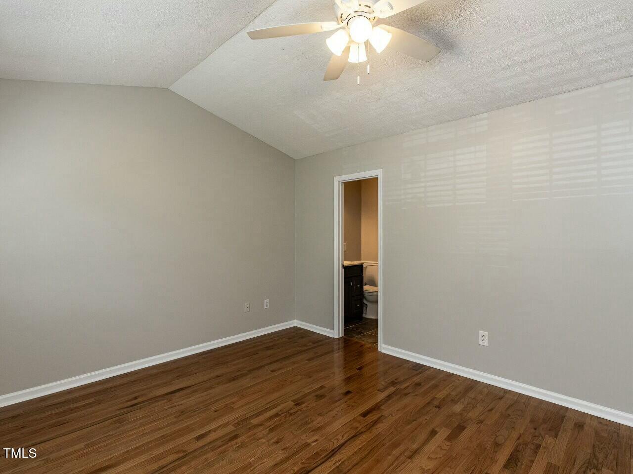116 Old Maple Lane Durham, NC 27713 - Photo 15 of 30 a view of an empty room with wooden floor