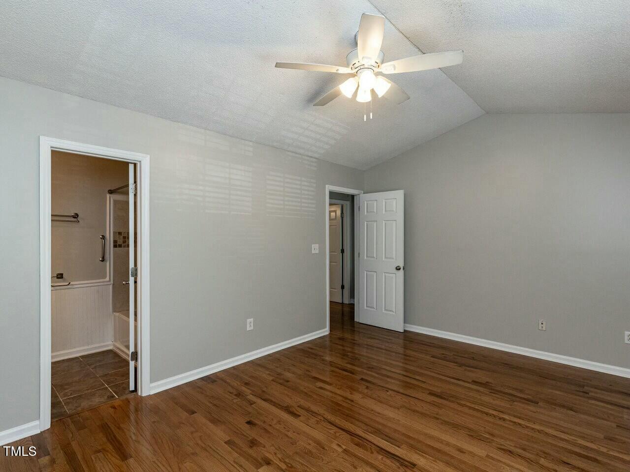116 Old Maple Lane Durham, NC 27713 - Photo 16 of 30 a view of an empty room with wooden floor