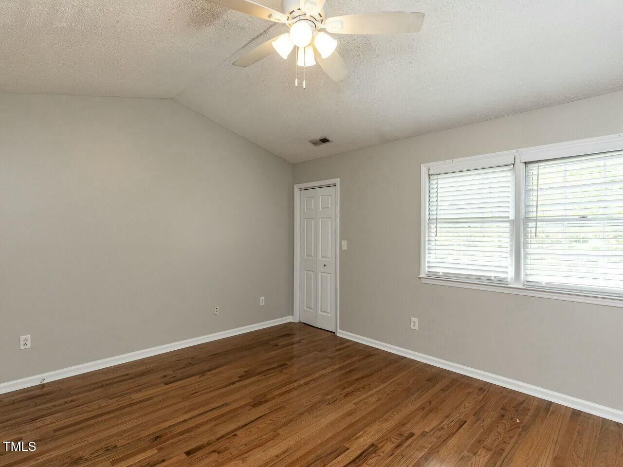 116 Old Maple Lane Durham, NC 27713 - Photo 18 of 30 wooden floor in an empty room with a window
