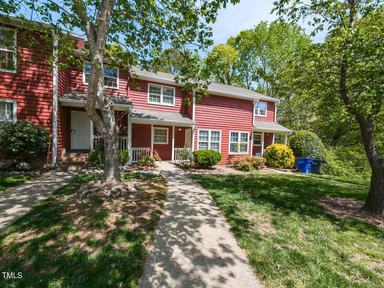 116 Old Maple Lane Durham, NC 27713 - Photo 2 of 30 a view of a house with a yard and lawn chairs