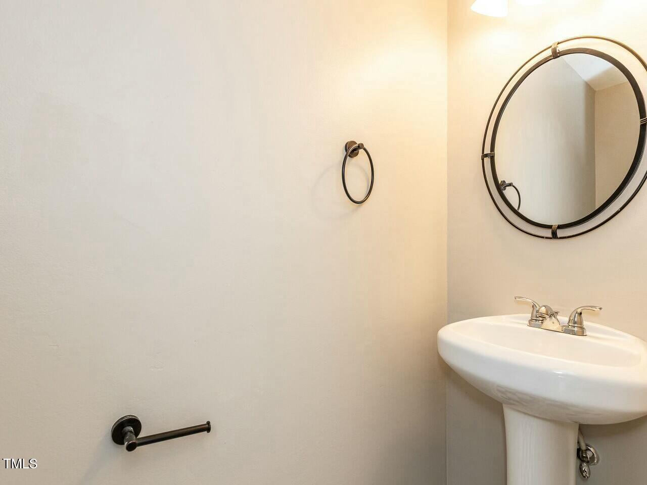 116 Old Maple Lane Durham, NC 27713 - Photo 7 of 30 a bathroom with a sink and a mirror
