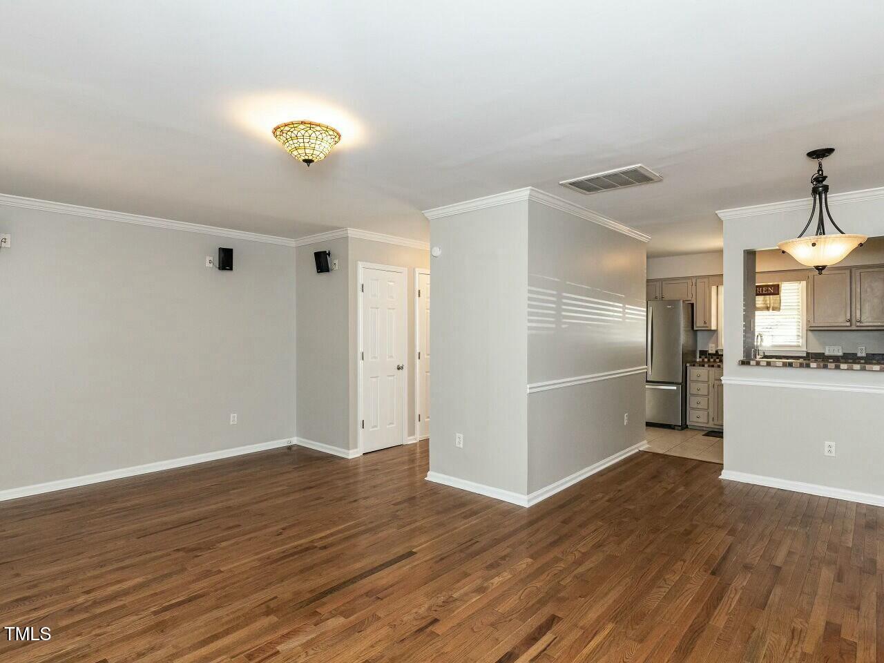 116 Old Maple Lane Durham, NC 27713 - Photo 10 of 30 a view of a kitchen with a sink and a refrigerator