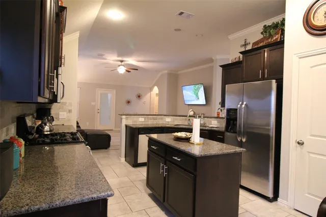 a kitchen with a refrigerator a sink and a refrigerator