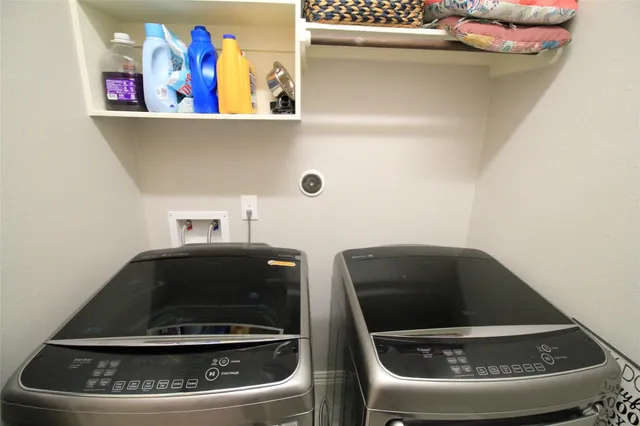 a utility room with dryer and washer