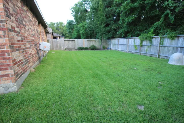 a view of a porch with furniture and garden